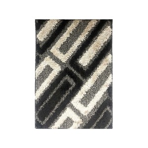 Tappeto da bagno t.b.t. con motivo astratto in nero e beige.