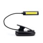 Lampada da notte t.b.t. nera con clip, collo flessibile e luce LED.