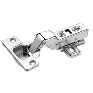 Primo piano di una cerniera per mobili color argento per uso interno.