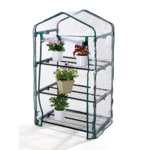 Piccola serra con piante su tre livelli di scaffale.