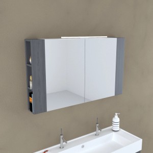 Mobile specchio t.b.t. con ripiani e illuminazione sopra un lavandino.