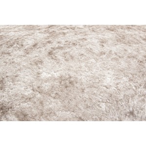 Primo piano di un cuscino/federa beige t.b.t. con texture morbida.