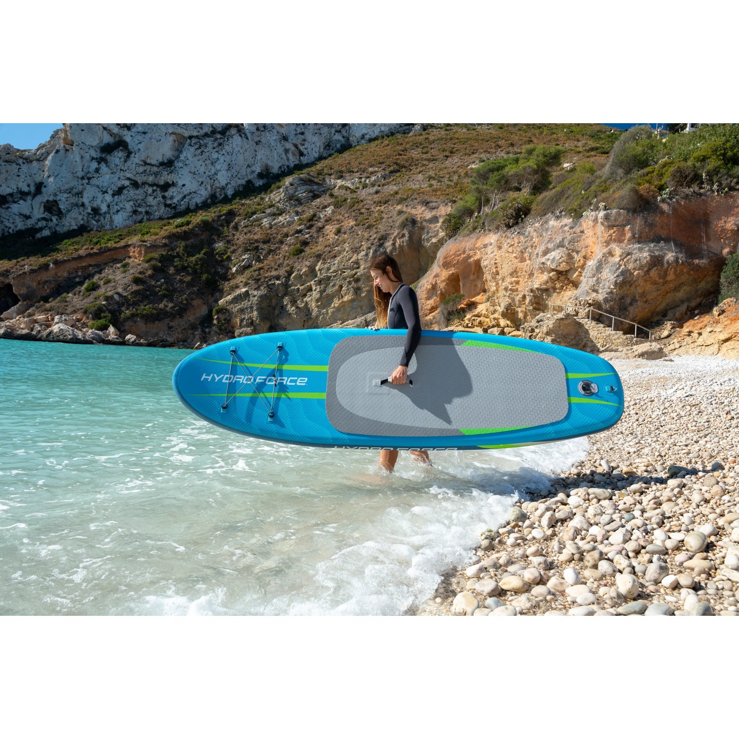 Bestway SUP Board Aqua Journey, stand-up paddleboard blu e verde con maniglia sulla spiaggia.