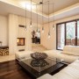 Moderna lampada da soffitto Luce Design Groove color rame con sei lampadine in soggiorno.