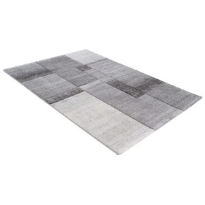 Tappeto moderno con motivo geometrico nei toni del grigio e del bianco.