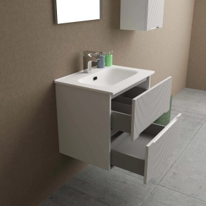 Mobile bagno bianco con due cassetti aperti e lavabo da appoggio. Arredo bagno.