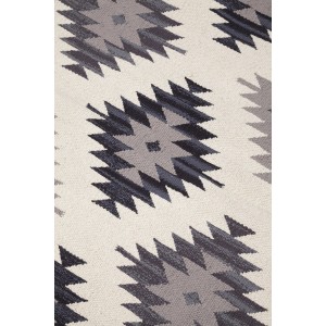 Motivo di una stuoia t.b.t. grigia con elementi a zigzag.