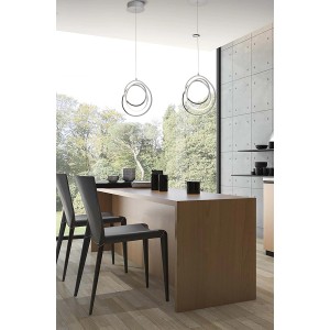 Moderne lampade a sospensione t.b.t. (Sospensioni) con design circolare sopra il tavolo da pranzo.