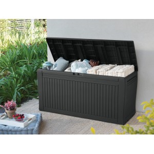 Box contenitore Keter Comfy 270 l aperta color antracite con cuscini in giardino.