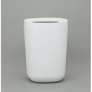 Cestino da bagno bianco rotondo con coperchio.