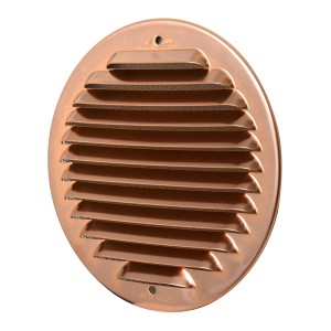 Griglia di ventilazione rotonda color rame per montaggio a parete.