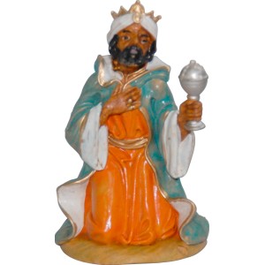 Statuina di re inginocchiato, parte di un presepe.