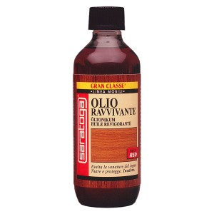 Olio per legno t.b.t. in contenitore di vetro marrone. Adatto per la cura e la protezione delle superfici in legno.