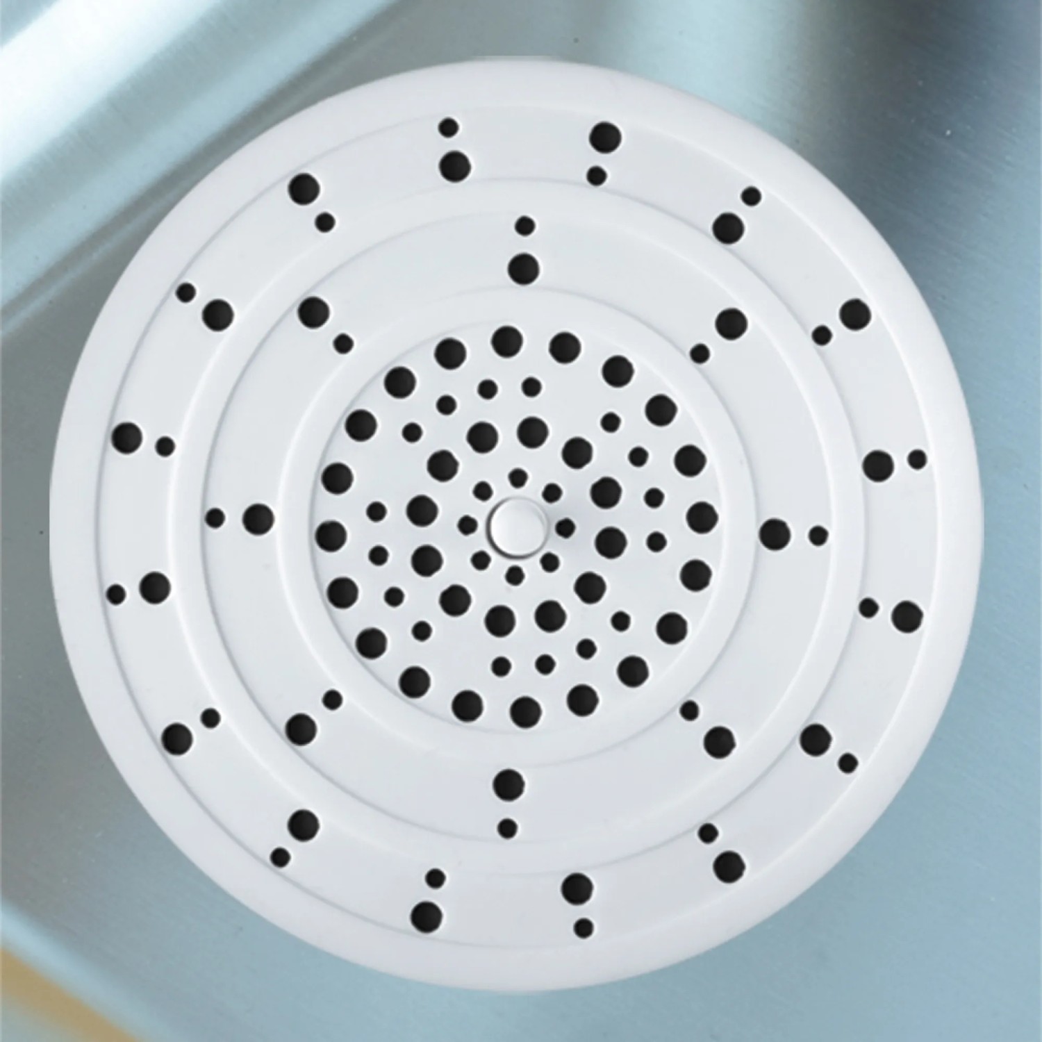 Filtro di scarico bianco Wenko in silicone per lavelli e lavabi.