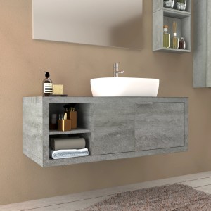 Mobile bagno grigio con lavabo da appoggio bianco e ripiani.