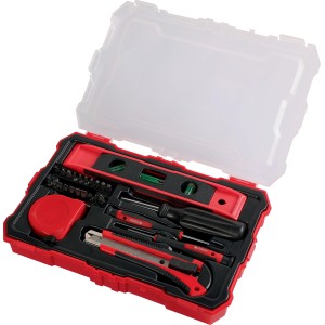 Cassetta degli attrezzi rossa aperta con livella, cacciavite, taglierino e metro a nastro. Set di attrezzi.