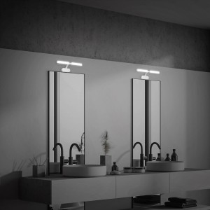 Moderna applique LED sopra due specchi in un bagno.