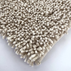 Tappeto da bagno beige con texture a pallini, t.b.t.