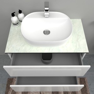Mobile lavabo con lavabo da appoggio, piano in marmo e cassetti bianchi.