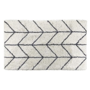 Tappeto da bagno t.b.t. con motivo grafico a zigzag in bianco e grigio.