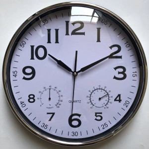 Orologio da parete con igrometro e termometro, cornice argentata, quadrante bianco.