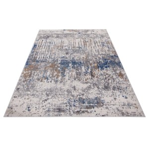 Tappeto moderno con motivo astratto in blu, grigio e beige.
