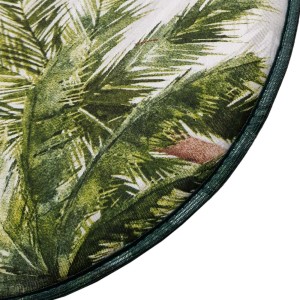 Dettaglio di un cuscino da esterno rotondo con motivo a palma verde.