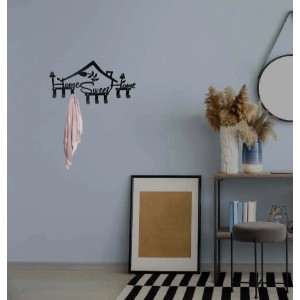 Appendiabiti da parete nero t.b.t. "Home Sweet Home" con asciugamano appeso.