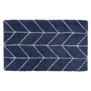 Tappeto da bagno blu con motivo grafico per il bagno.