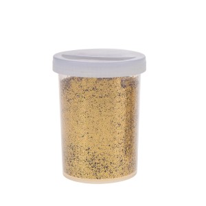 Glitter dorato in contenitore per decorazioni natalizie.