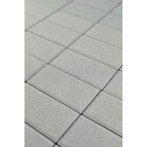 Primo piano di pavimentazione esterna grigia.