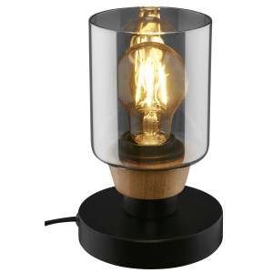 Lampada da scrivania moderna con corpo in vetro, elemento in legno e base nera.