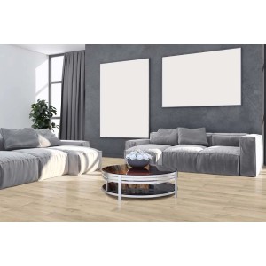 Pavimento vinilico chiaro in soggiorno con divano e tavolo grigi.