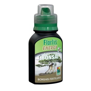 Fertilizzante liquido per bonsai in flacone scuro con etichetta verde.