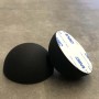 Due cuscinetti neri, emisferici con superficie adesiva per accessori lavatrice.