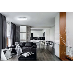 Plafoniera LED t.b.t. moderna in una scena di soggiorno.