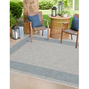Tappeto da esterno grigio con bordo blu, ideale per patio e giardino.