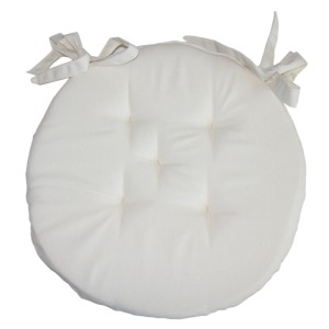 Cuscino rotondo color crema con lacci per sedie.