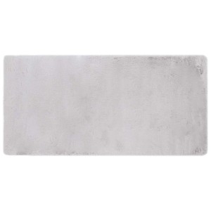 Tappeto a pelo lungo rettangolare grigio.