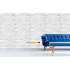 Rivestimento murale effetto pietra, parete in mattoni bianchi come decorazione nel soggiorno.