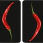 Copri piano cottura Wenko Hot Peperoni, set da 2 con motivi di peperoncino rosso su sfondo nero.