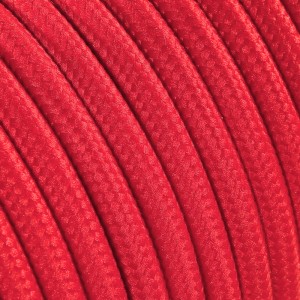Cavo tessile rosso per lampade, dettaglio. Componente per la costruzione di lampade.