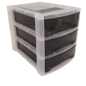 t.b.t. Cassettiera con tre cassetti neri e struttura trasparente.