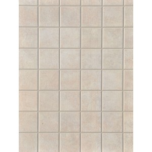 Paraschizzi per cucina in piastrelle quadrate beige.