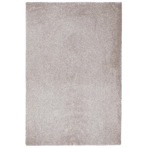 Tappeto beige a pelo corto. Tappeto morbido e monocolore per spazi abitativi.