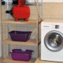 Einhell GC-WW 6538 set sistema acqua domestica con pompa, tubo di aspirazione e accessori su scaffale.