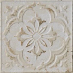 Piastrella da rivestimento decorativa beige con motivo floreale.