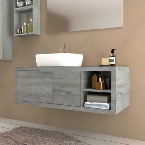 Mobile bagno grigio con lavabo d'appoggio e spazio per riporre gli oggetti.
