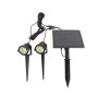 Set di luci solari: Due faretti da giardino neri con picchetto e pannello solare per illuminazione decorativa.