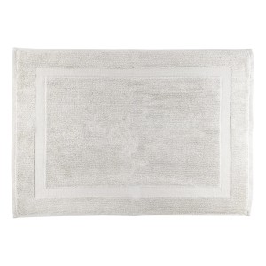 Tappeto da bagno t.b.t. bianco con design rettangolare.